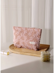 Pink corduroy makeup bag with floral lace embroidery and H&R BAG brand tag