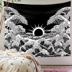 Detail of black and white Japanese wave tapestry with sun art on a bedroom wall