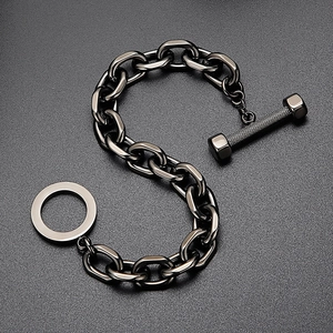 Detail of gunmetal stainless steel chain bracelet with textured barbell toggle clasp