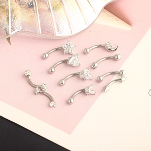 Detailed set of silver stainless steel piercing studs with star heart and zircon stones