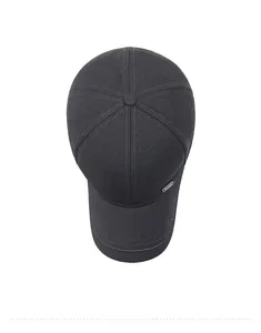 Top down view of a charcoal grey baseball cap with six-panel structure and metal tag