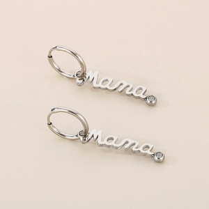 Detail of silver Mama letter earrings with sparkling crystal accents in a pair