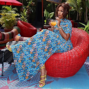Detail of blue geometric chain print maxi dress with high-slit and slim fit design