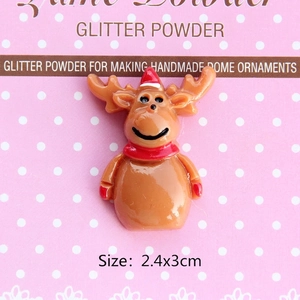 Macro detail of a 2.4x3cm brown resin reindeer charm with a red scarf and hat