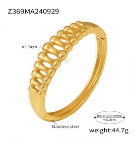 Detail of gold-plated stainless steel herringbone cuff bangle with 1.9cm wide hollow pattern