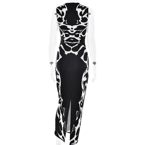 Detail view of the sleek back zipper and leg slit on a sleeveless leopard print dress