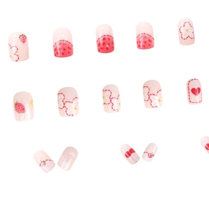 Cute pink strawberry and flower press-on nails with cartoon graffiti and silver glitter