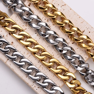 Chic gold and silver polished stainless steel curb chains on elegant travertine stone