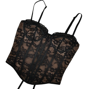 Detailed view of black lace corset top with sheer mesh panels and supportive boning