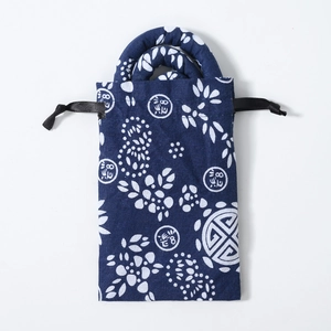 Blue fabric drawstring bag with white floral patterns for dreadlock hair accessories