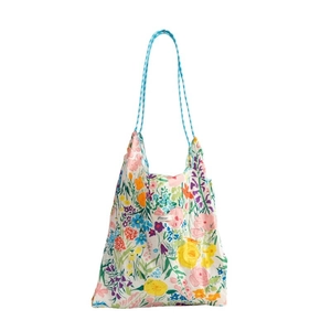 Floral print tote bag with blue drawstring straps for women in minimalist white fabric