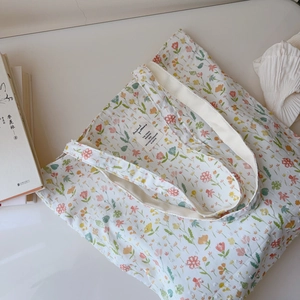 Macro detail of floral cotton tote bag with vintage flower print and fabric label