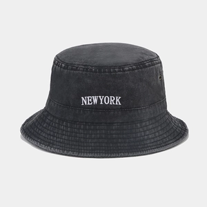 Detail of vintage washed grey bucket hat with white New York embroidery and metal eyelets