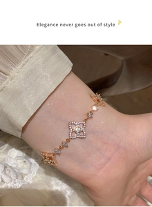Close-up of a rose gold floral hollow bracelet with shimmering zircon stones on a wrist