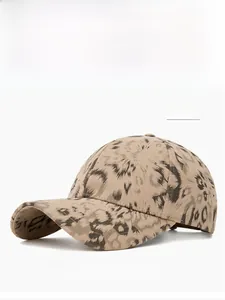 Detailed close-up of khaki leopard print baseball cap with cotton twill texture and curved brim