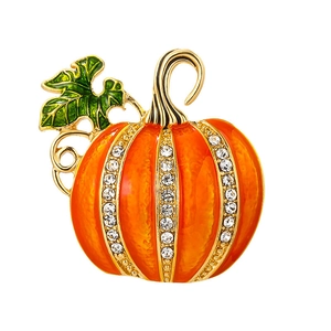 Halloween pumpkin brooch with orange enamel and white rhinestones on gold base