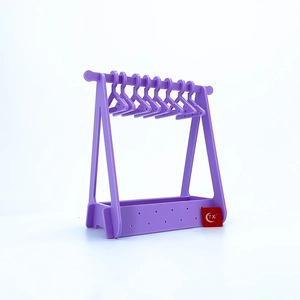 Detail of light purple acrylic mini coat hangers for earring storage and organization