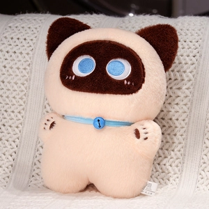 Siamese cat plush toy with blue collar and heart-shaped face on cozy white blanket