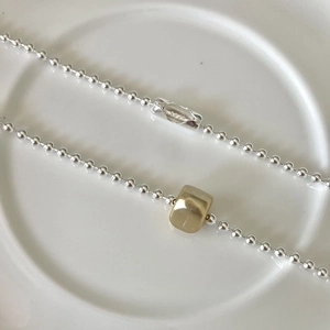 Minimalist 925 sterling silver bead necklace with a matte gold square bead and S925 engraving
