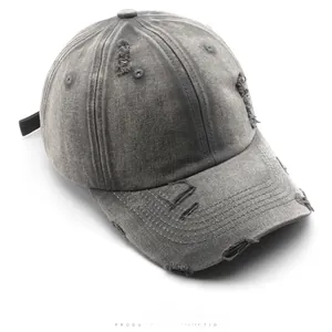 Top view of distressed grey washed denim baseball cap with vintage worn-out details