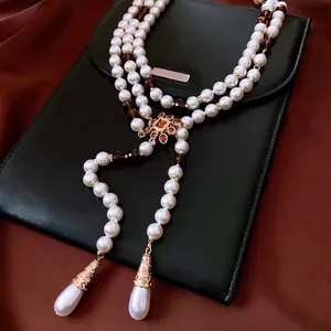 Vintage multi-layer pearl necklace with golden flower pendant and drop pearl charms
