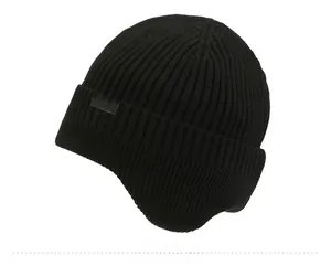 Close-up of black ribbed knit beanie with SPORT logo patch and warm texture
