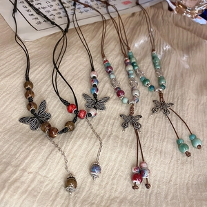 Ethnic beaded multi-layer necklace with silver butterfly pendant and handmade cord