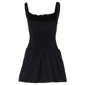 Detail view of black shirred bodice and ruffled straps on a mini sleeveless A-line dress