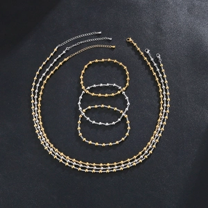 Gold and silver beaded jewelry set featuring durable stainless steel necklaces and bracelets