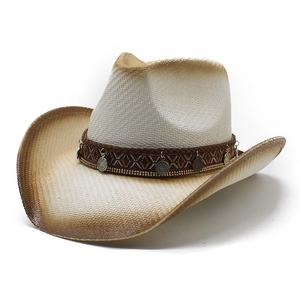 Detail of western straw hat with ethnic woven band and vintage metal charms