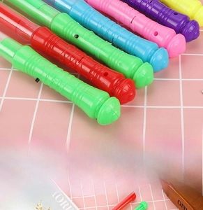 Close-up of colorful LED glow sticks with black power switches for concerts and parties