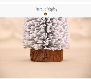 Detail of flocked mini Christmas tree showing white snow texture and natural wood base
