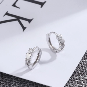 Elegant 925 sterling silver heart-shaped huggie earrings with clear cubic zirconia stones