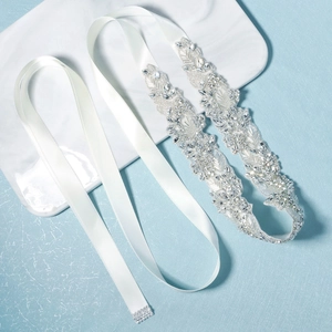 Luxurious bridal sash with floral rhinestones and beads on a white satin ribbon