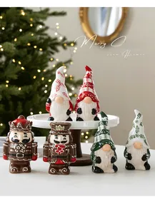 Detailed view of festive ceramic Christmas gnomes and gingerbread nutcracker set