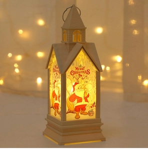 Detail of Christmas lantern with warm LED light, Merry Christmas graphic and handle