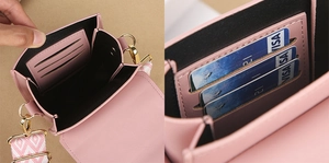 Detail view of pink PU leather bag featuring three card slots and golden metal hooks