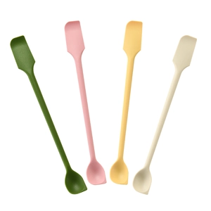 Set of four double-ended silicone jam spatulas and spoons in green, pink, yellow, and beige