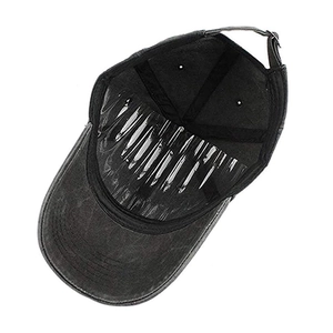 Detail of adjustable strap and internal lining on dark grey washed cotton baseball cap