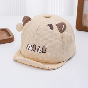 Detail of baby milk cow hat featuring soft cotton fabric and cute 3D animal ears