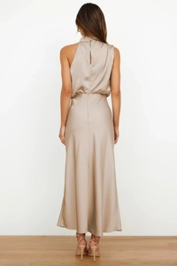 Detailed back view of champagne satin halter dress featuring a seamless hidden zipper