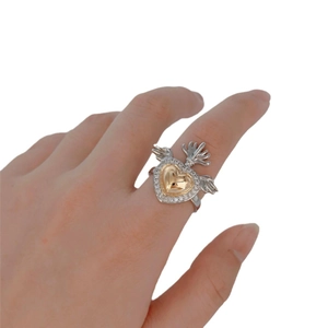 Gothic sacred heart ring featuring golden heart and wings with diamond-encrusted silver band