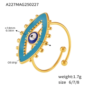 Macro shot of gold-plated evil eye ring with blue enamel and 14mm size marking