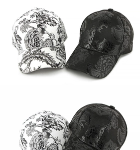 Detail of vintage floral paisley print on structured curved brim baseball caps