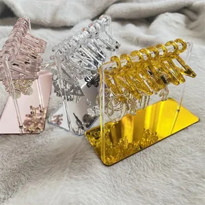 Three-piece acrylic mini hanger earring organizers in rose gold, silver, and gold finishes