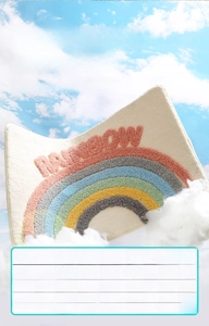 Detail of plush rainbow bath mat showing thick absorbent texture and antibacterial properties