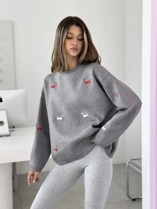 Detailed view of Dachshund embroidery pattern on grey knitted crewneck pullover sweater