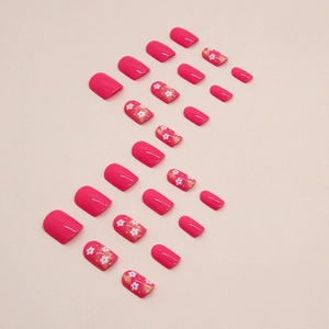 Short bright fuchsia press-on nails with white floral patterns 24-piece set