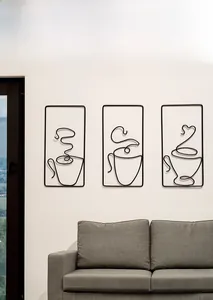 Three-piece black iron wire coffee cup wall art in a modern minimalist living room