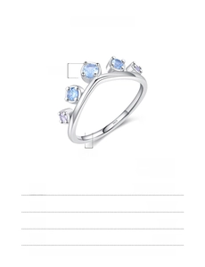 Macro detail of crown ring in 925 sterling silver with blue cubic zirconia stones